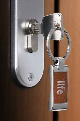 Key that says life unlocking a door